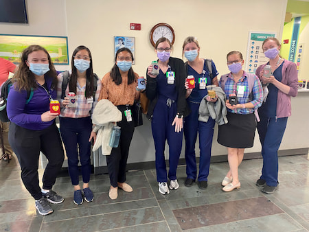 Children's Mercy Pediatric Residents pose with KC drink holders